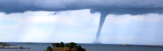 water spout near island